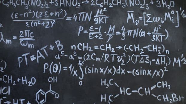 Intricate mathematical and chemical equations chalked on a blackboard symbolizing education and science.