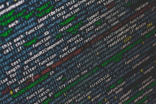 Close-up of colorful programming code displayed on a computer screen.
