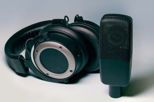 High-quality studio headphones and microphone for professional audio setups.