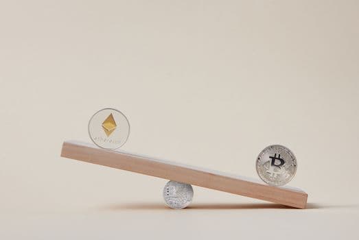 Minimalist image of Ethereum and Bitcoin coins balancing on a plank, symbolizing crypto market dynamics.